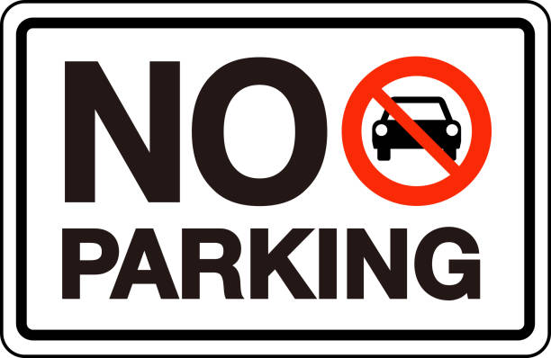A sign displaying "NO PARKING" with a red circle and line over a car symbol, indicating parking is prohibited.