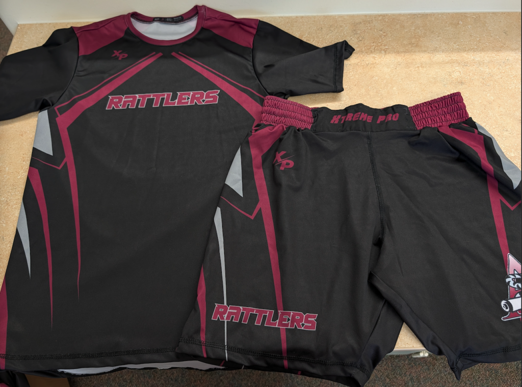 Black athletic shirt and shorts with maroon accents and "Rattlers" logo, designed for team sports.